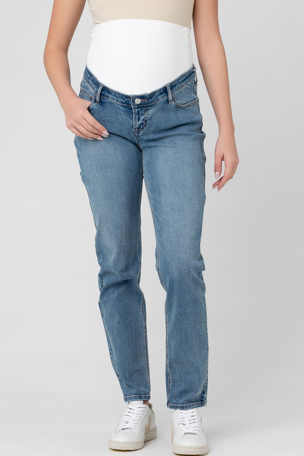 A pair of maternity jeans with a straight leg cut and over-bump waistband, in a vintage wash denim fabric.